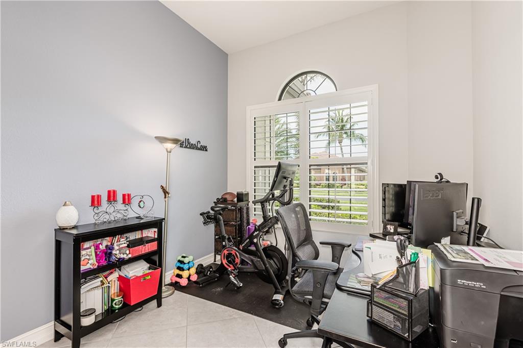 7307 Acorn Way Naples, FL 34119 - Photo 17 of 22 Office space featuring baseboards and light tile patterned flooring