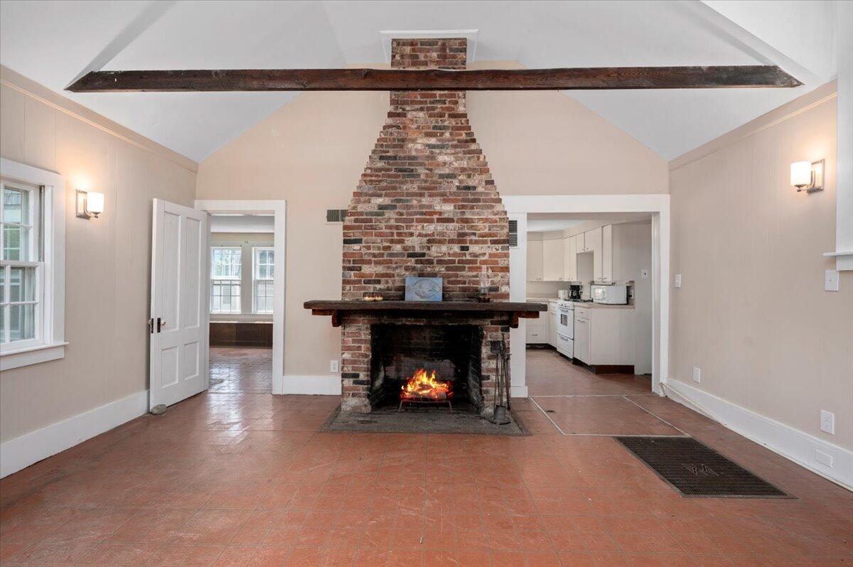 6 Priscilla Alden Road Provincetown, MA 02657 - Photo 22 of 58 a living room with furniture and a fireplace