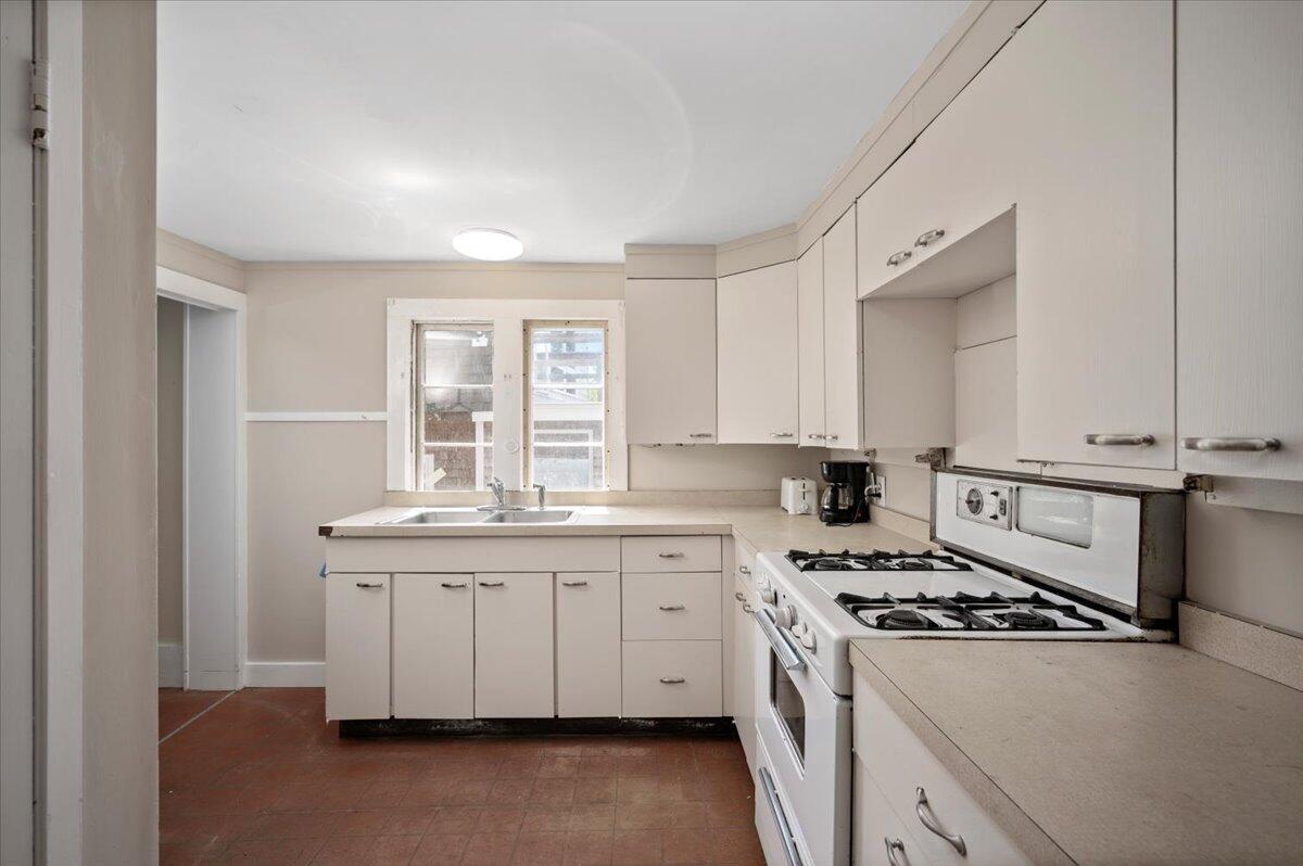 6 Priscilla Alden Road Provincetown, MA 02657 - Photo 26 of 58 a kitchen with stainless steel appliances a sink a stove a refrigerator and cabinets