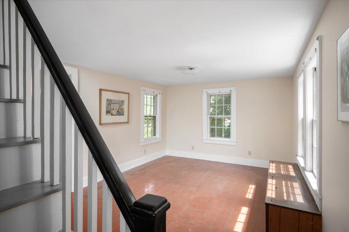 6 Priscilla Alden Road Provincetown, MA 02657 - Photo 30 of 58 a view of an empty room with wooden floor and stairs