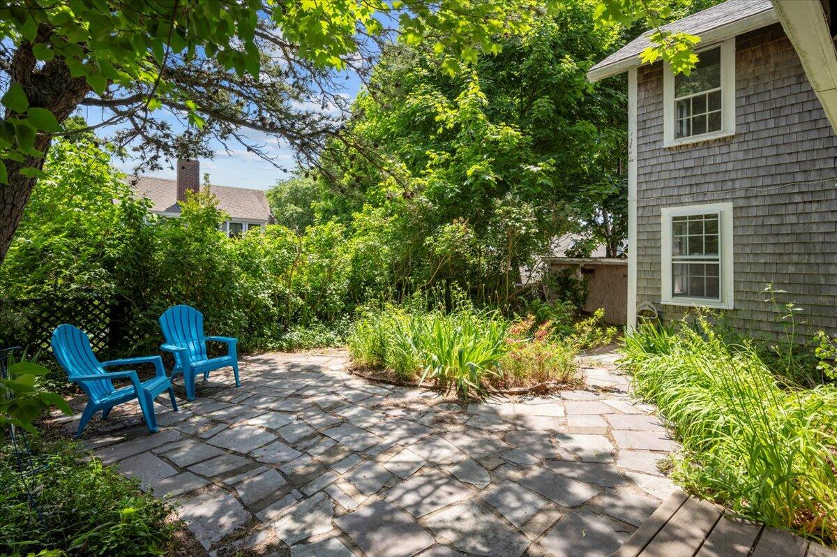 6 Priscilla Alden Road Provincetown, MA 02657 - Photo 7 of 58 a view of chair and tables in the backyard of the house
