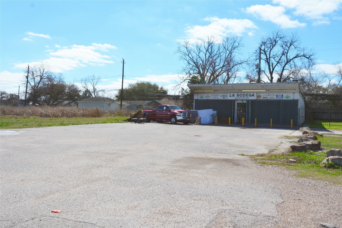 10013 West Montgomery Road Houston, TX 77088 - Photo 2 of 6 a front view of a house with a yard and garage
