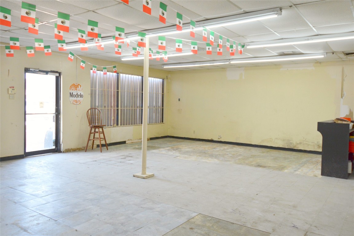 10013 West Montgomery Road Houston, TX 77088 - Photo 3 of 6 a room with water heater and wooden cabinets