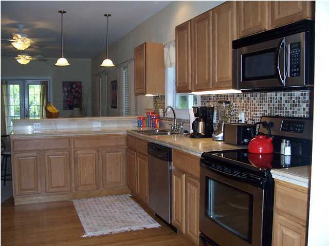 22 Central Way Santa Rosa Beach, FL 32459 - Photo 3 of 6 a kitchen with stainless steel appliances a stove a sink and a microwave