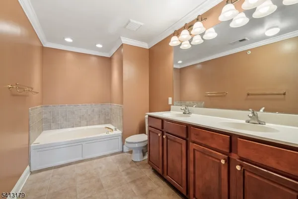 a bathroom with a sink a toilet and bathtub