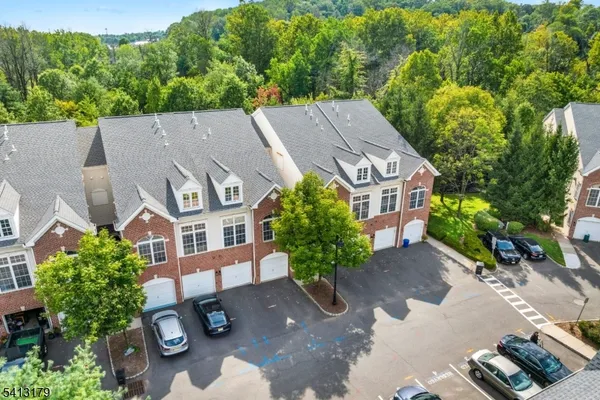an aerial view of a house with yard and outdoor seating