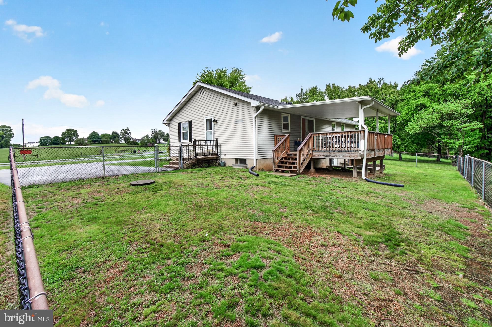 5601 Woodville Road Mount Airy, MD 21771 - Photo 42 of 54 a view of a house with a yard and sitting area