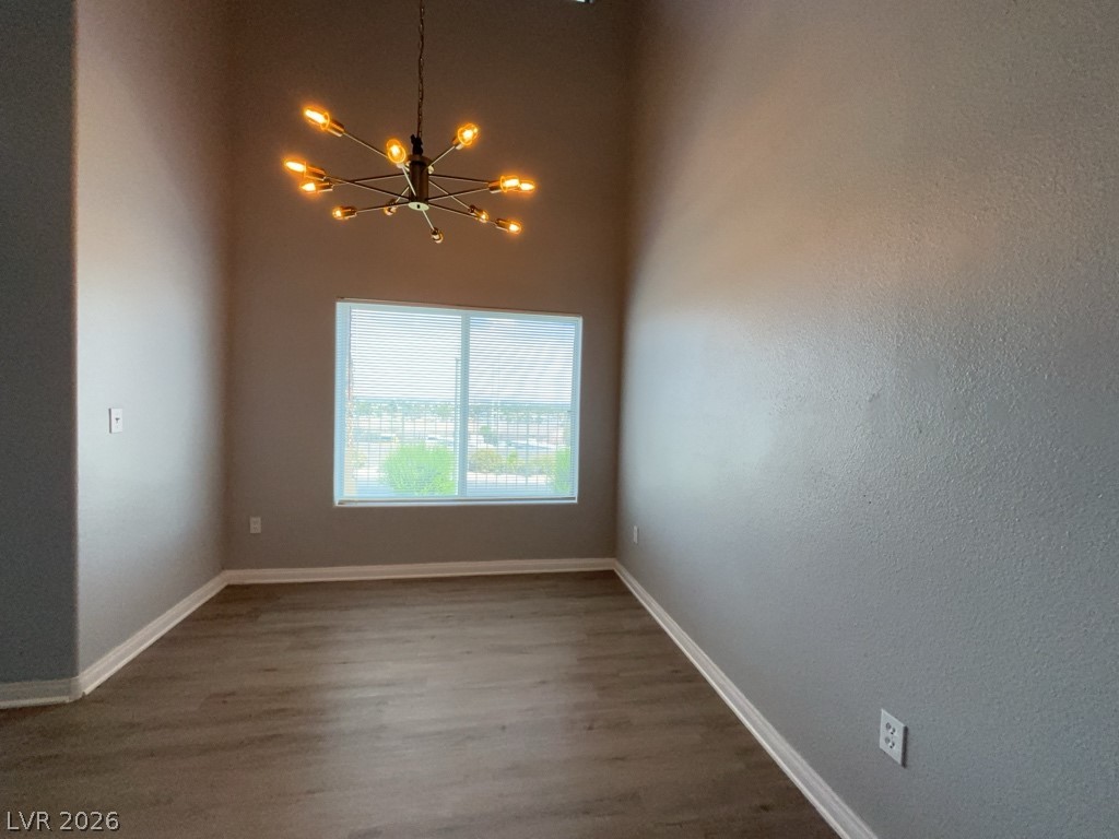 4915 East Russell Road, Unit 115 Las Vegas, NV 89120 - Photo 3 of 7 This versatile room features elevated ceilings and expansive windows, ideal for diverse design opportunities.