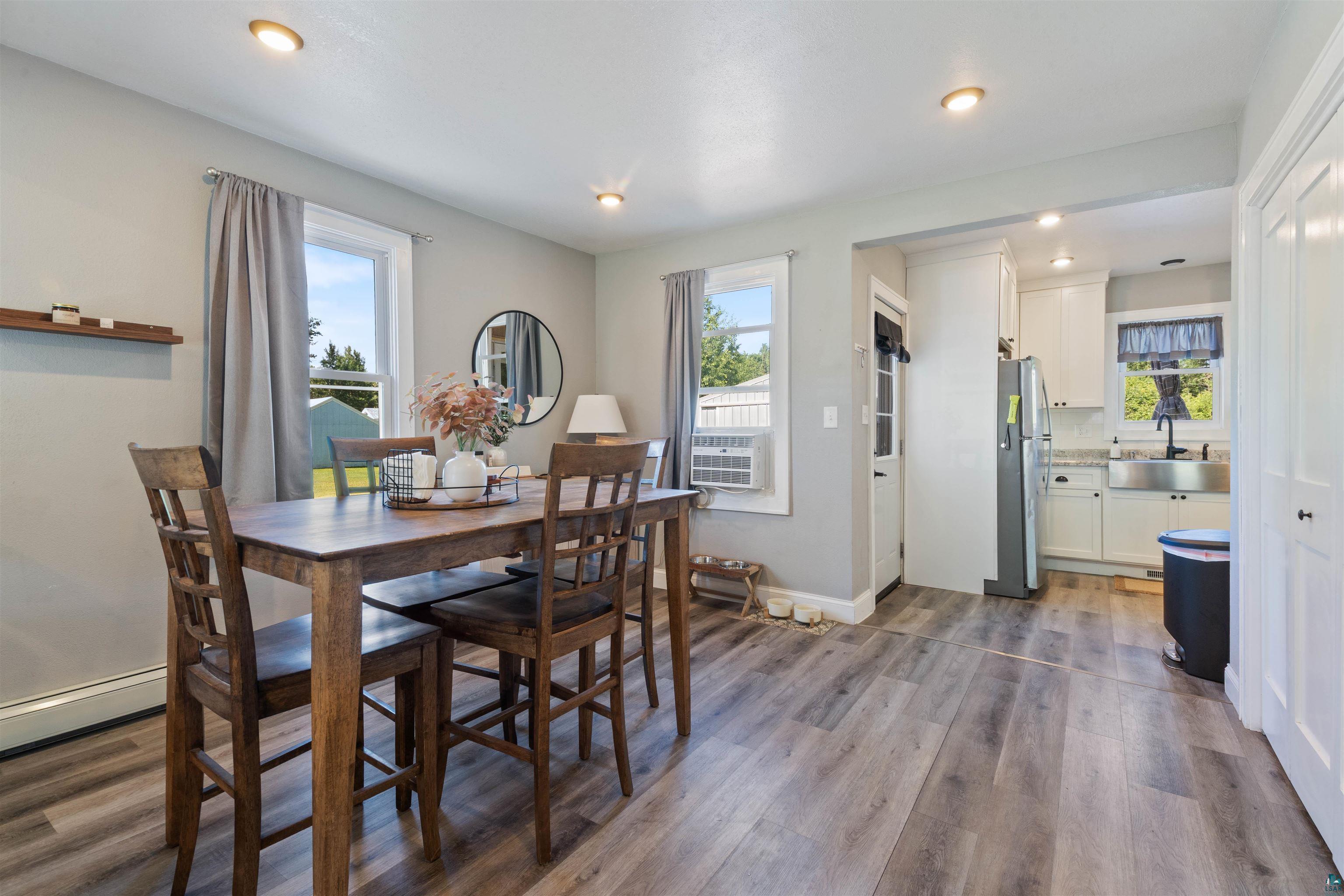 3835 South County Rd K South Range, WI 54874 - Photo 11 of 29 Contemporary dining area featuring wood-finish flooring and recessed lighting