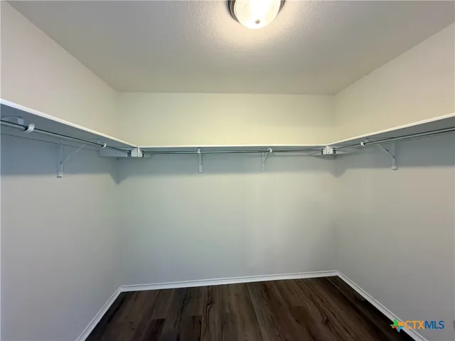 a view of a room with shelf on the wall