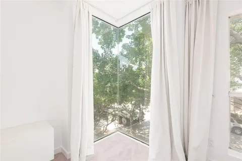 a view of a room with a large window