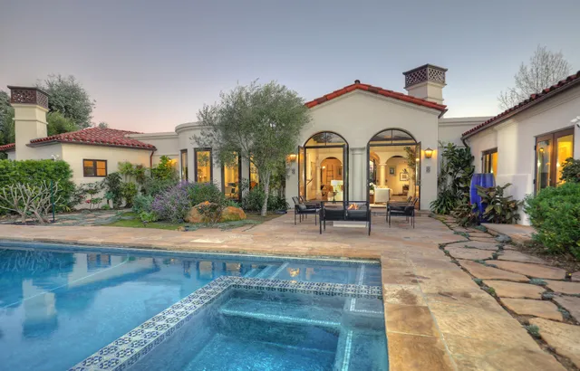 a view of swimming pool with an outdoor space and seating area
