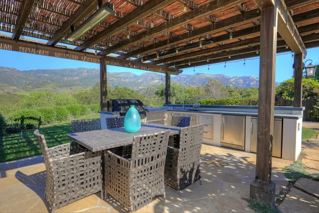 a view of city from balcony with seating area