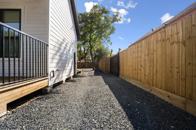 a view of a backyard with pathway