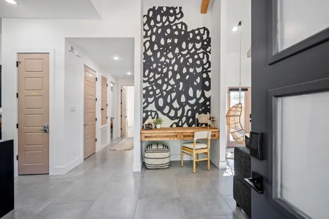 a view of a livingroom with furniture and window