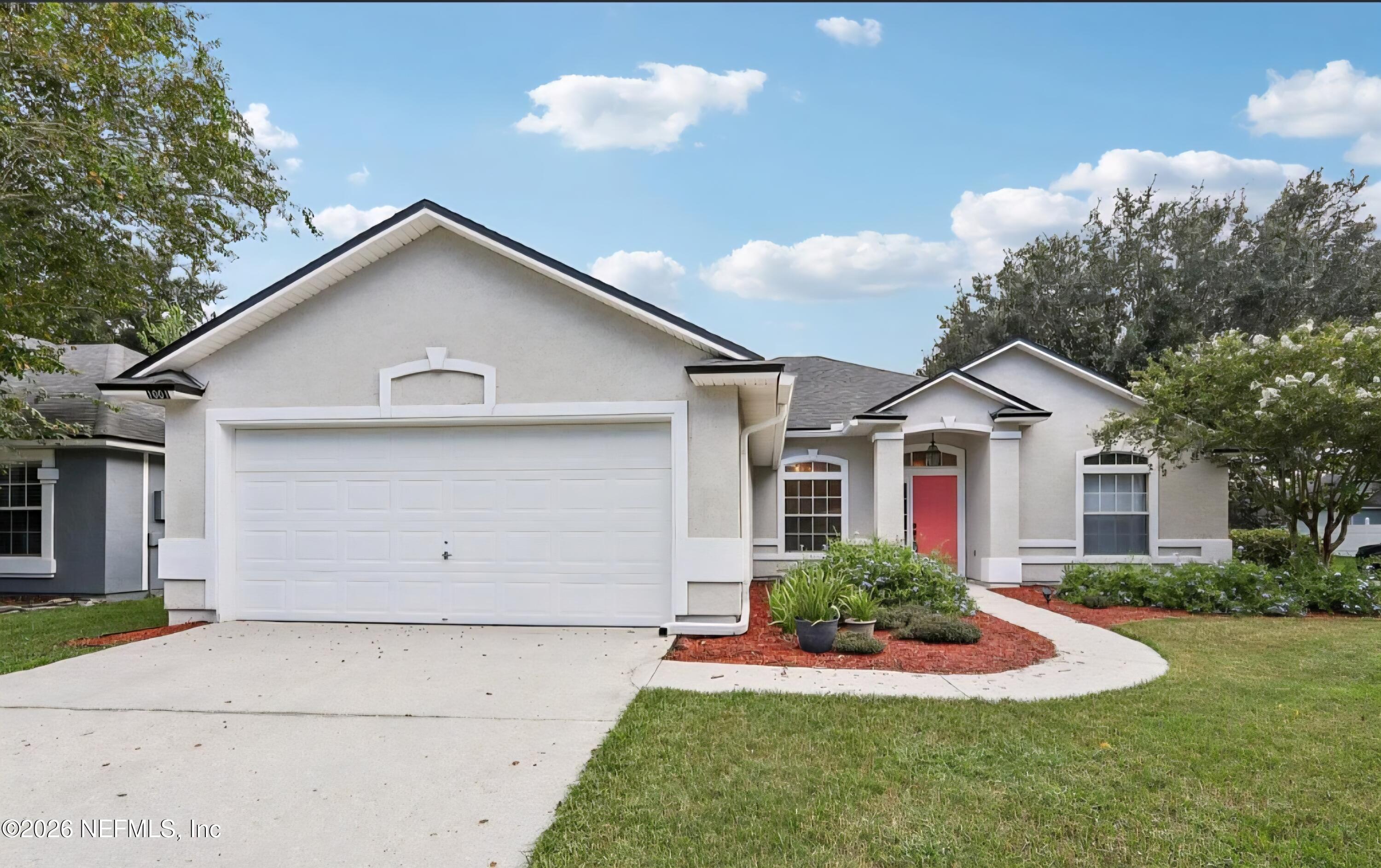 1001 Andrea Way St. Johns, FL 32259 - Photo 1 of 61 a front view of house with a yard and trees
