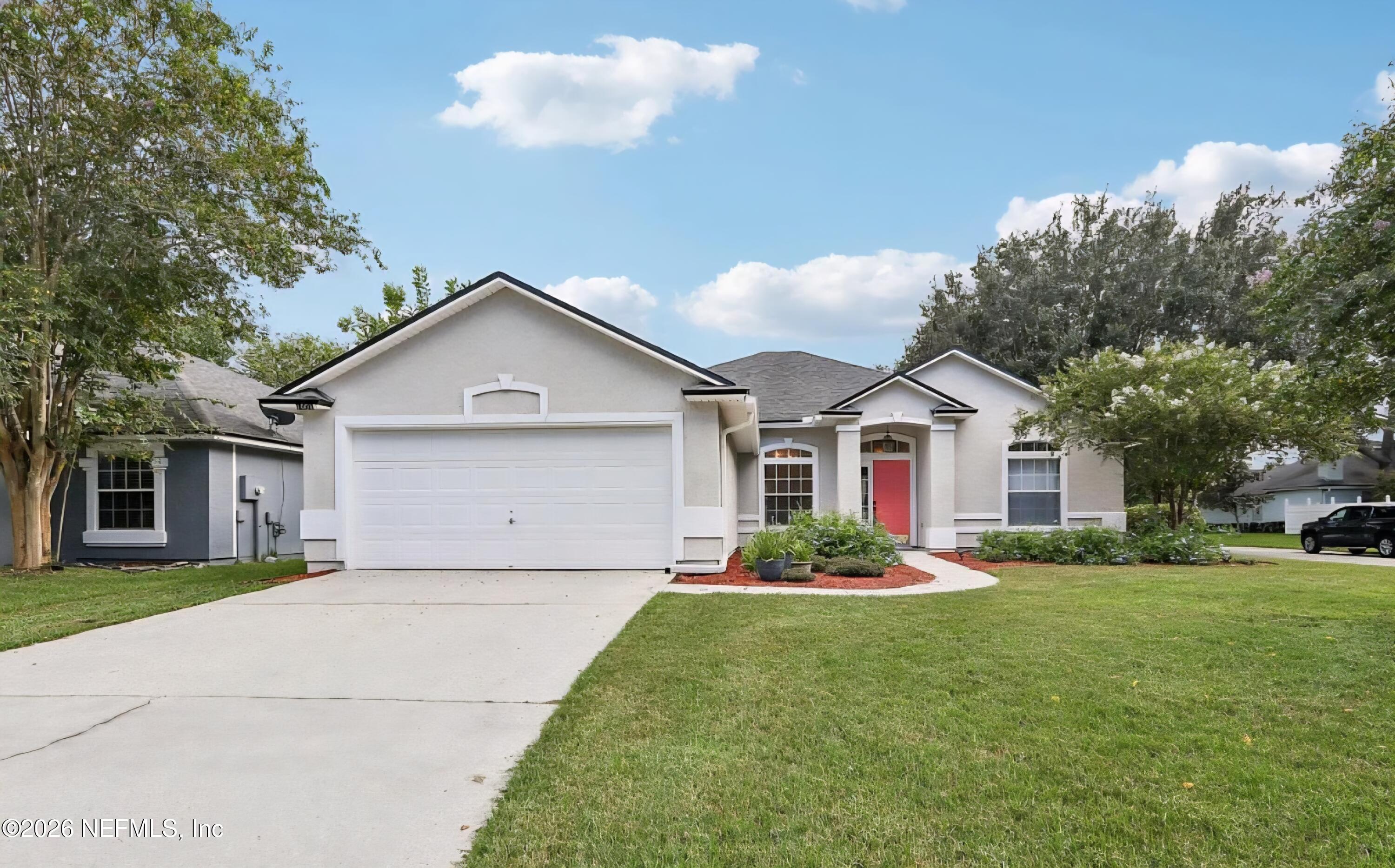 1001 Andrea Way St. Johns, FL 32259 - Photo 2 of 61 a front view of house with yard and green space
