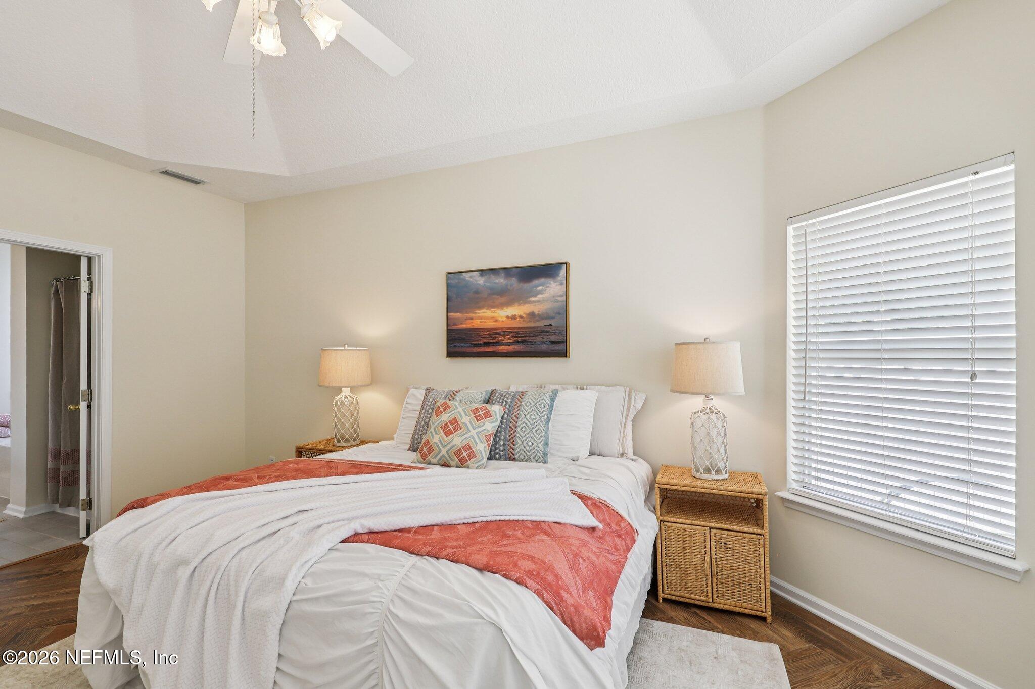 1001 Andrea Way St. Johns, FL 32259 - Photo 28 of 61 a bedroom with a bed and a painting on the wall