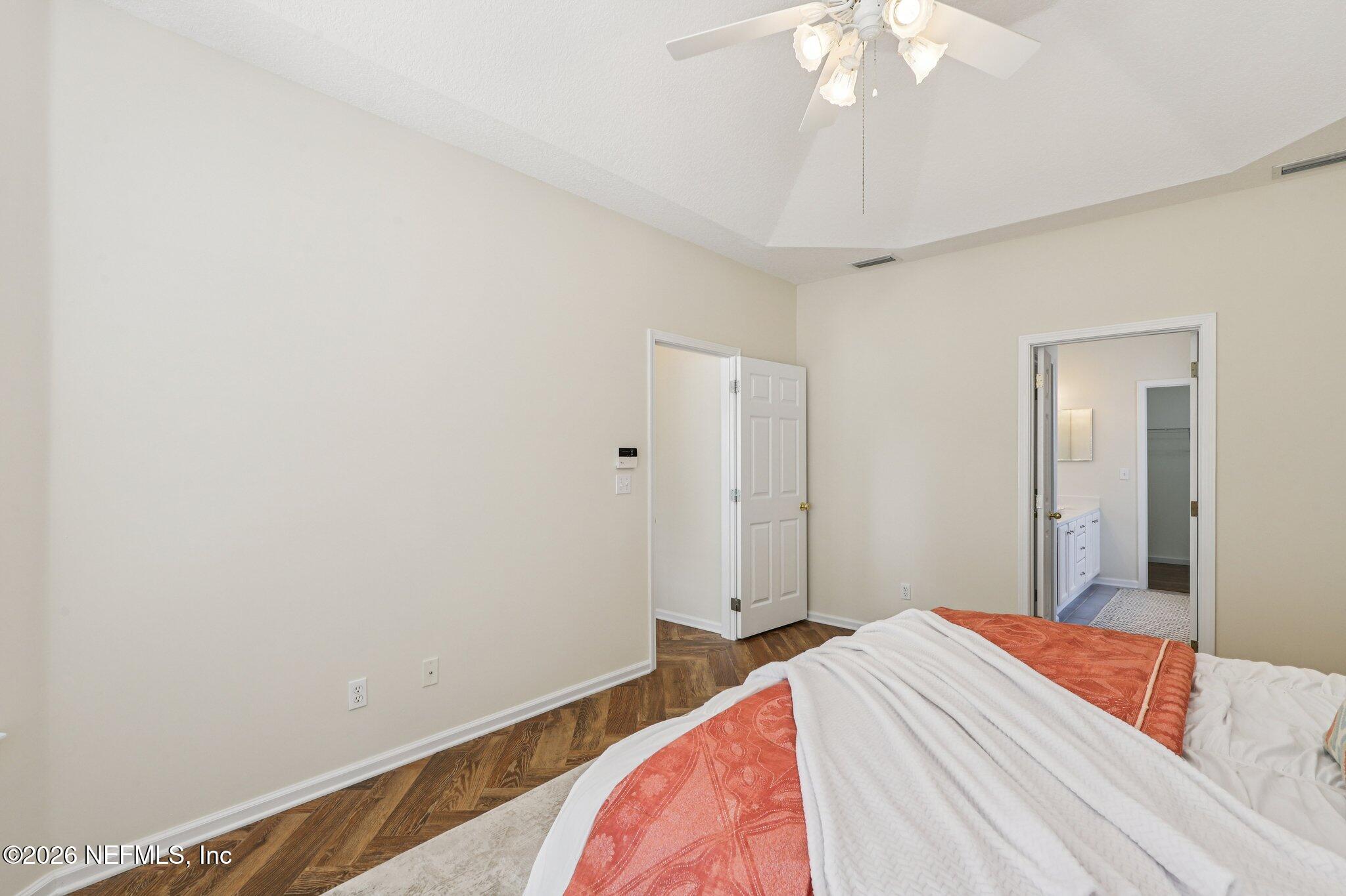 1001 Andrea Way St. Johns, FL 32259 - Photo 29 of 61 a bedroom with a bed and a chandelier fan