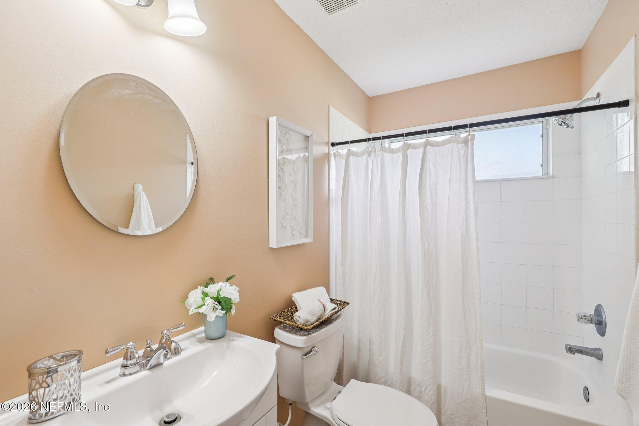 1001 Andrea Way St. Johns, FL 32259 - Photo 34 of 61 a bathroom with a sink mirror vanity and a toilet