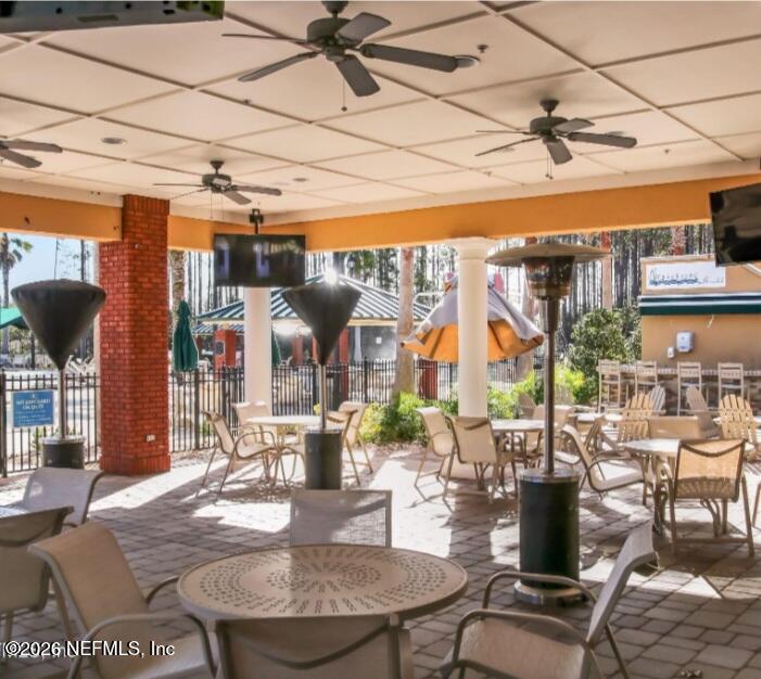 1001 Andrea Way St. Johns, FL 32259 - Photo 48 of 61 a view of a patio with dining table and chairs