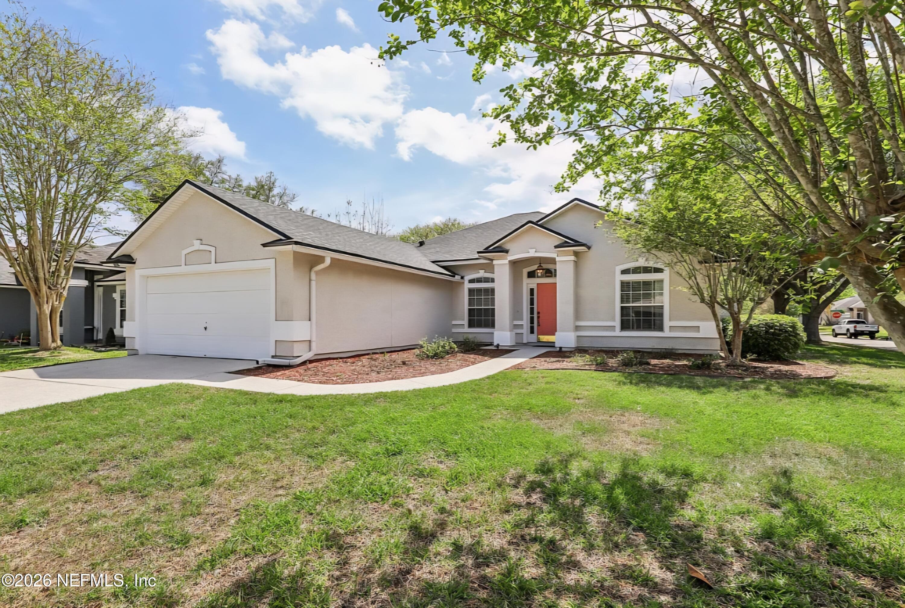 1001 Andrea Way St. Johns, FL 32259 - Photo 5 of 61 a view of a yard in front of a house with large trees