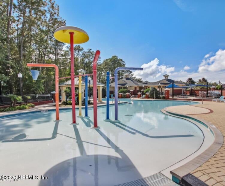 1001 Andrea Way St. Johns, FL 32259 - Photo 57 of 61 a view of a swimming pool with a table and chairs