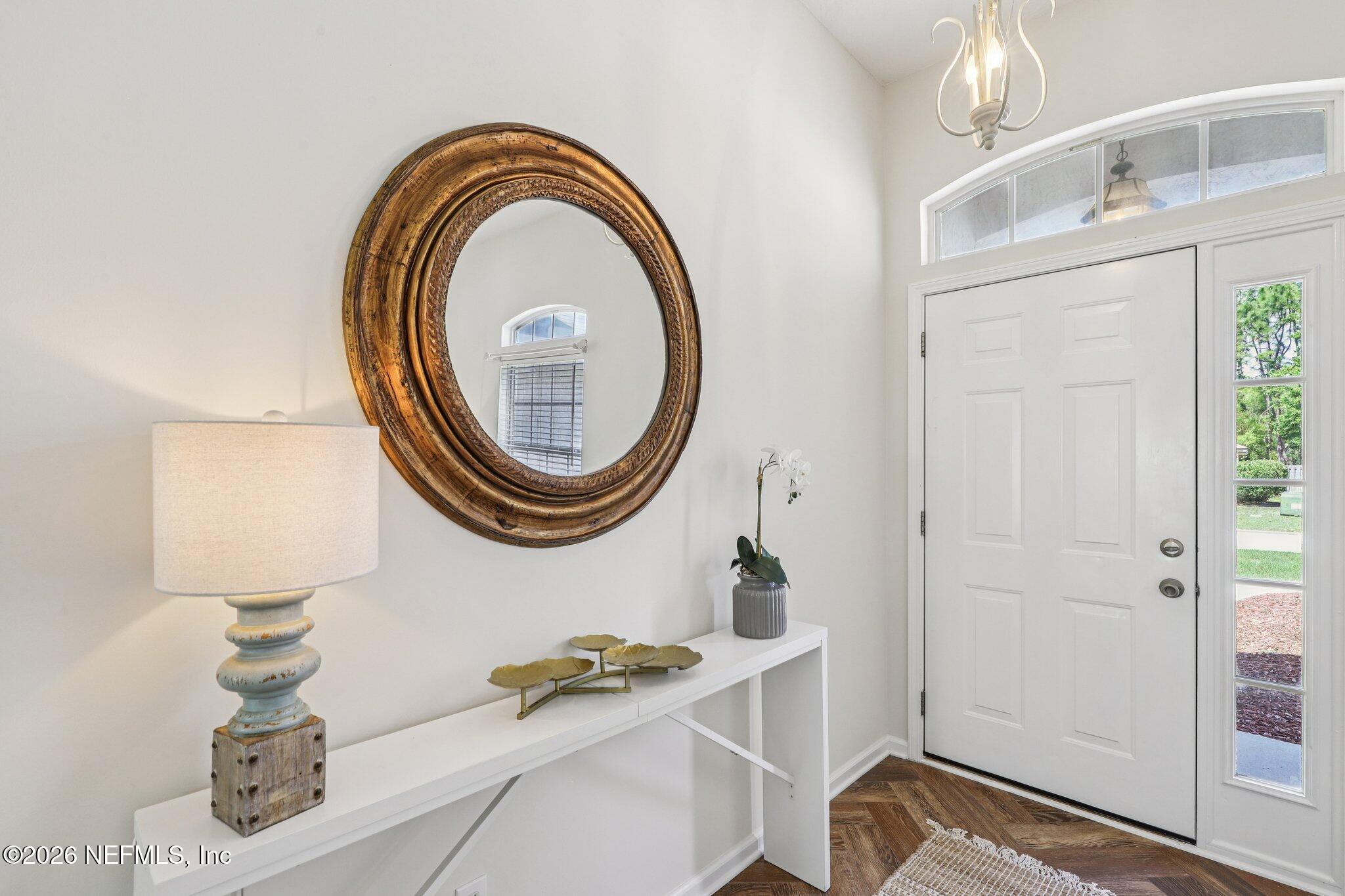 1001 Andrea Way St. Johns, FL 32259 - Photo 8 of 61 a bathroom with a sink a mirror and a shower