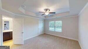 233 Carsons Walk Macon, GA 31206 - Photo 10 of 15 a view of a room with a ceiling fan and a window