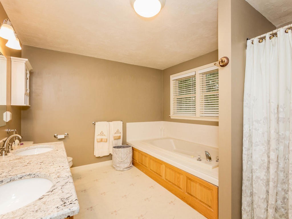 11 Rivers Edge Drive Rowley, MA 01969 - Photo 13 of 24 a bathroom with a tub sink and mirror