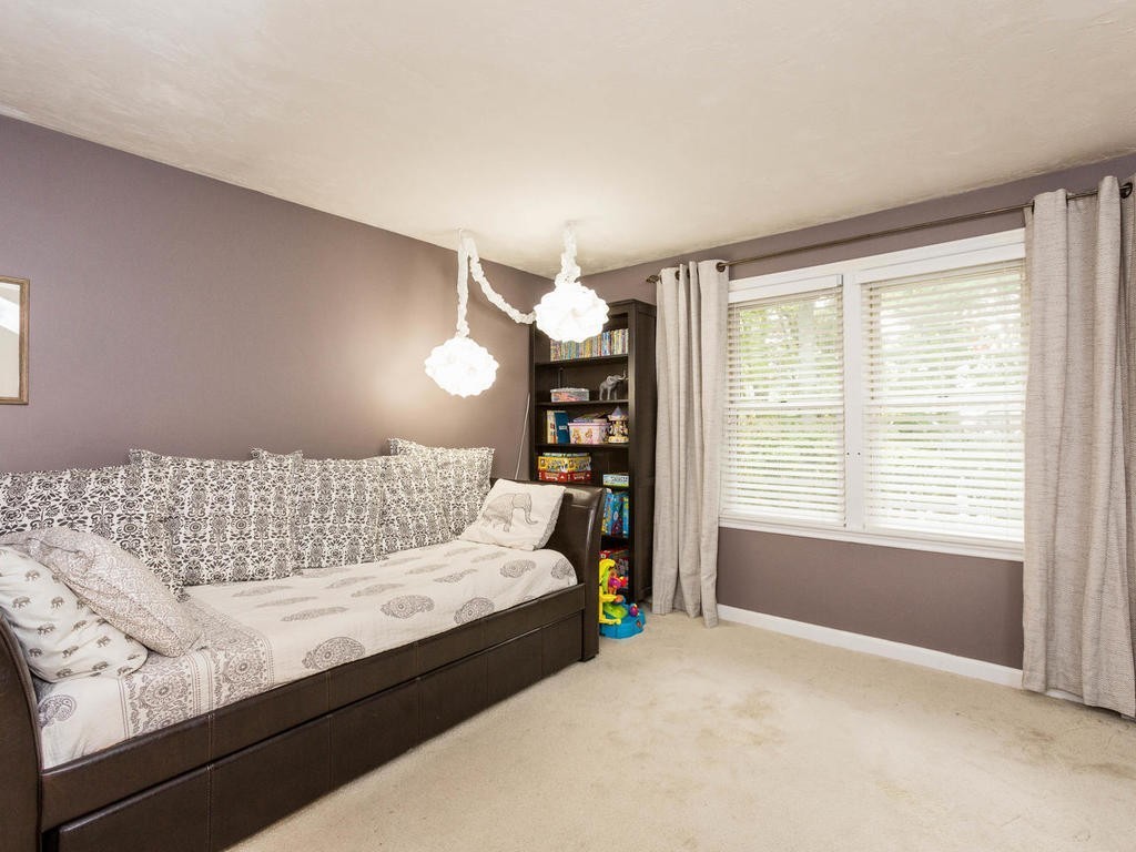 11 Rivers Edge Drive Rowley, MA 01969 - Photo 17 of 24 a bedroom with a large bed and a window
