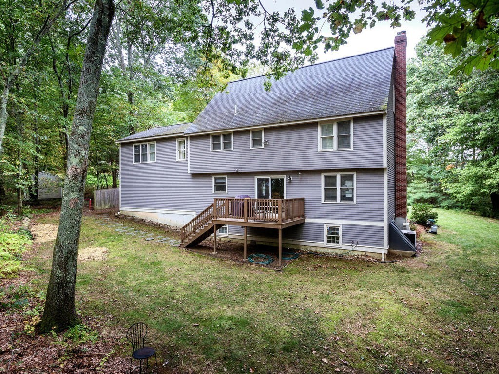 11 Rivers Edge Drive Rowley, MA 01969 - Photo 24 of 24 a backyard of a house with table and chairs