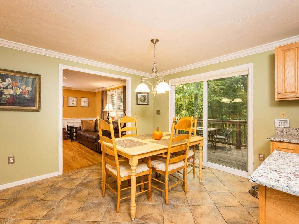 11 Rivers Edge Drive Rowley, MA 01969 - Photo 5 of 24 a view of a dining room with furniture wooden floor and chandelier