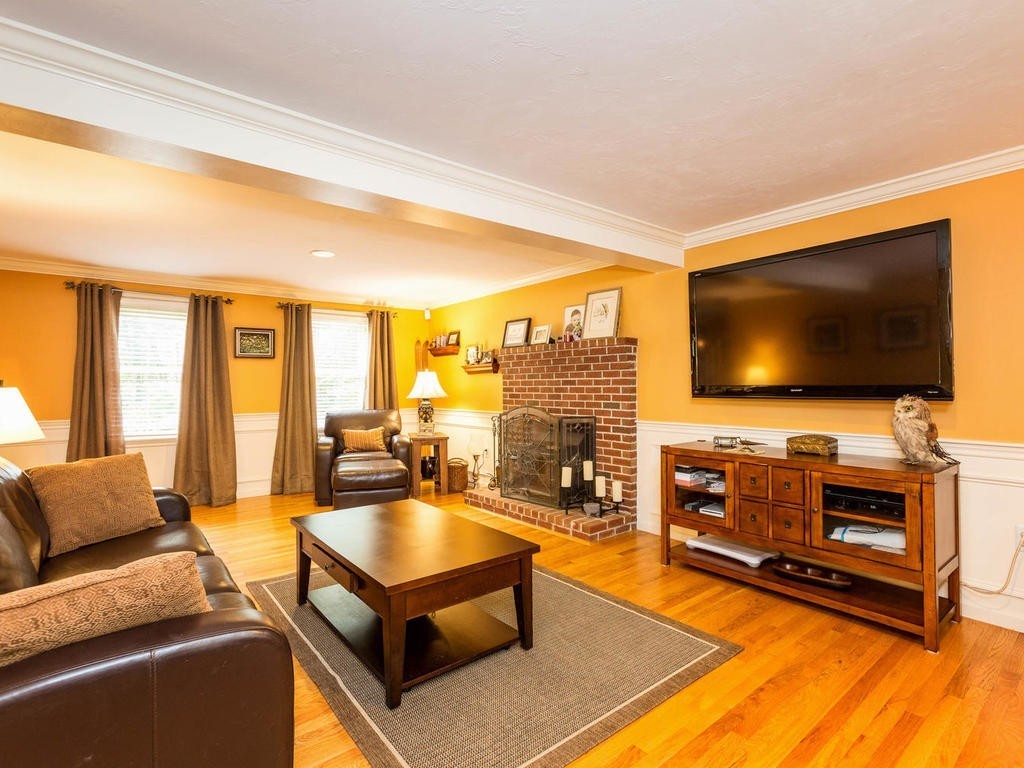 11 Rivers Edge Drive Rowley, MA 01969 - Photo 7 of 24 a living room with furniture and a flat screen tv