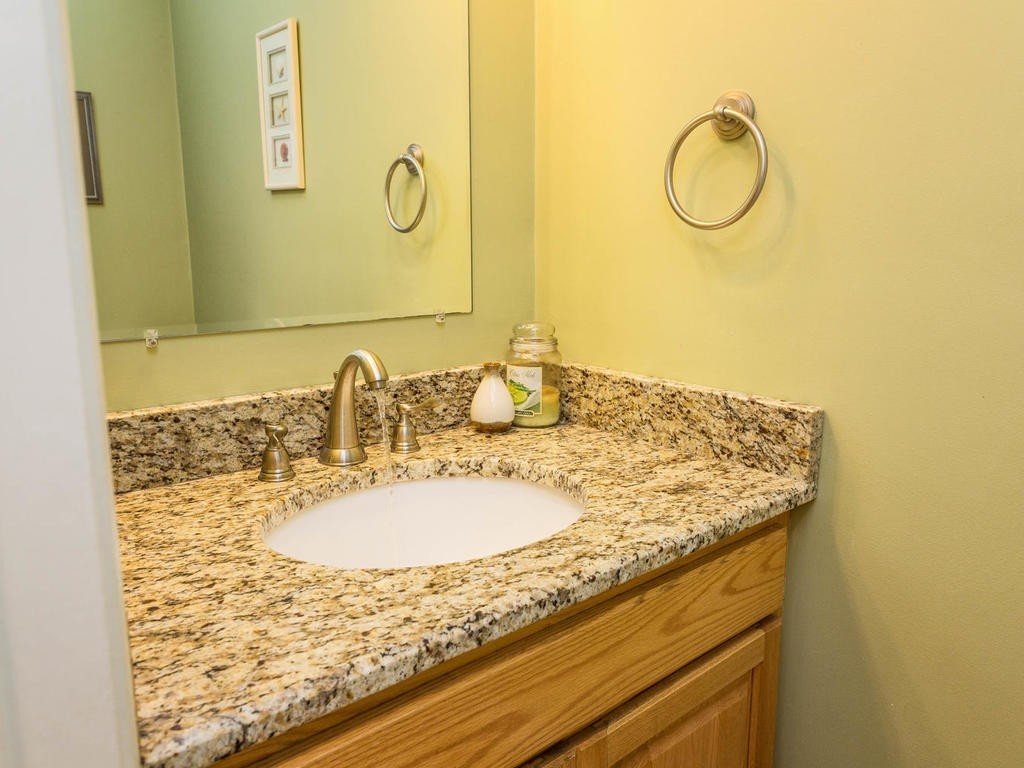 11 Rivers Edge Drive Rowley, MA 01969 - Photo 8 of 24 a bathroom with a granite countertop sink and a mirror