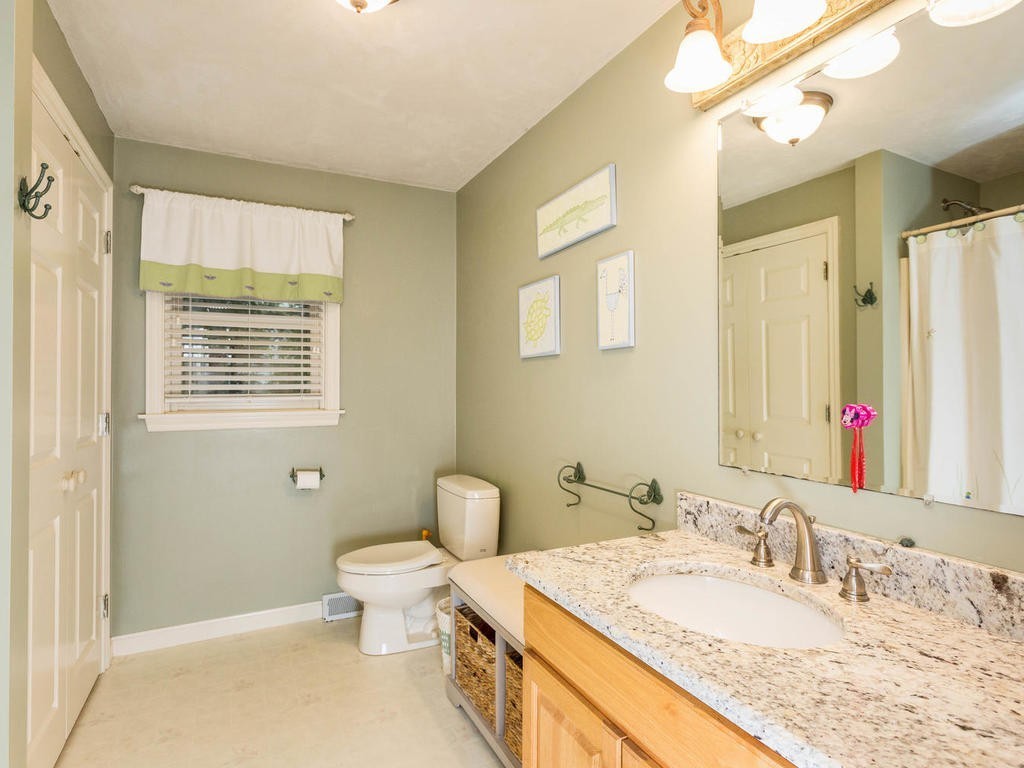 11 Rivers Edge Drive Rowley, MA 01969 - Photo 10 of 24 a bathroom with a granite countertop sink toilet and mirror