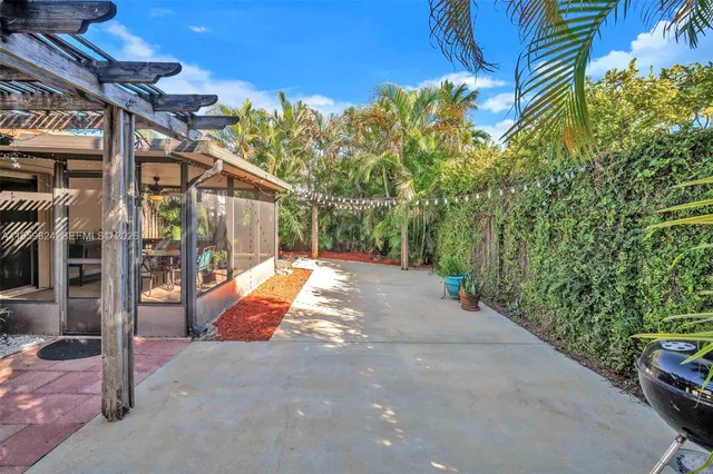a view of a backyard with a patio