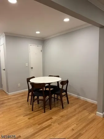 a kitchen with granite countertop a refrigerator stove and sink