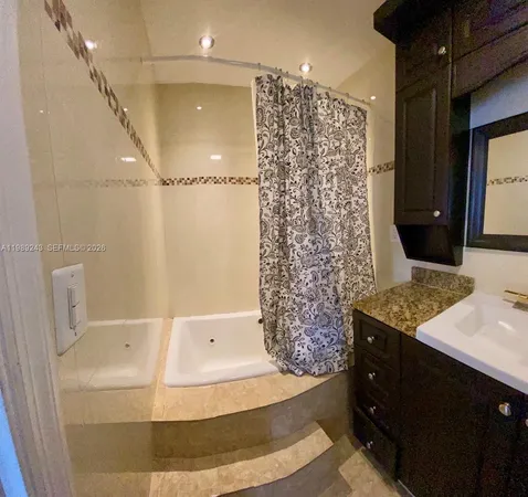 a bathroom with a sink and a shower