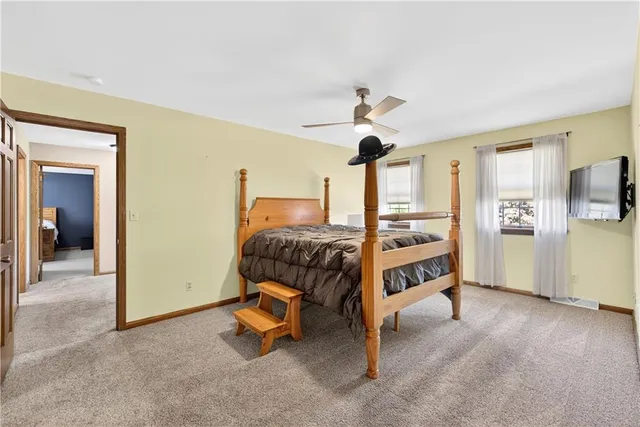 a room with a table and a chandelier