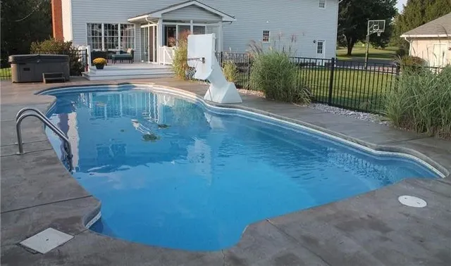 a swimming pool view with a outdoor space