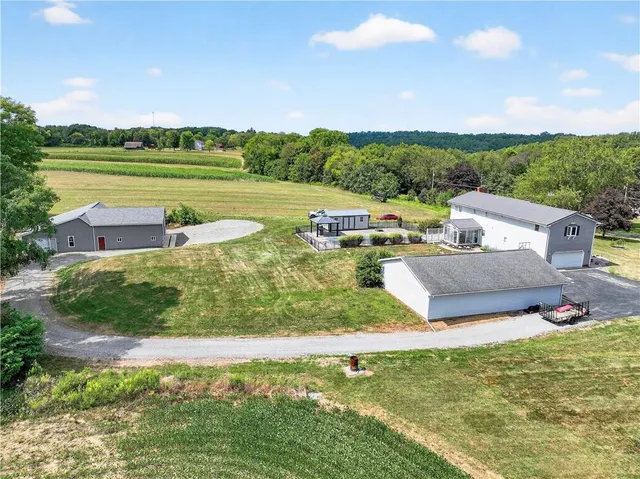 a view of a lake with couches and city view