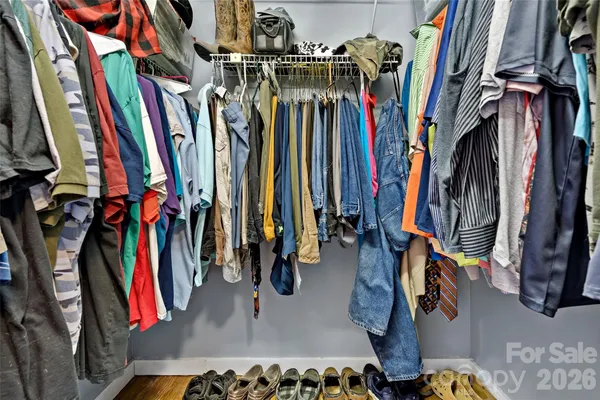 a kitchen that has a lot of cabinets a washer and dryer