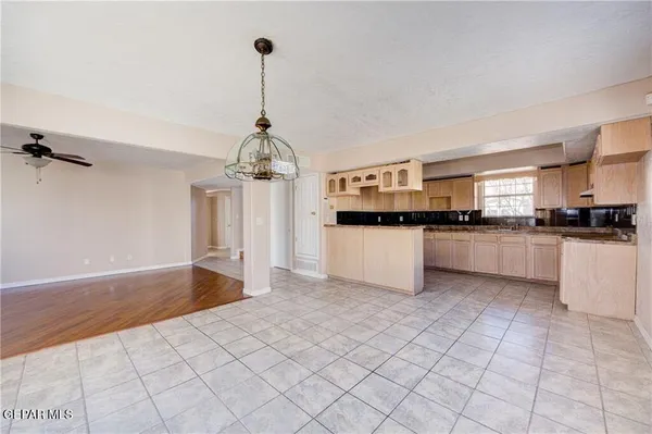 a kitchen with stainless steel appliances granite countertop a stove a sink dishwasher and a refrigerator
