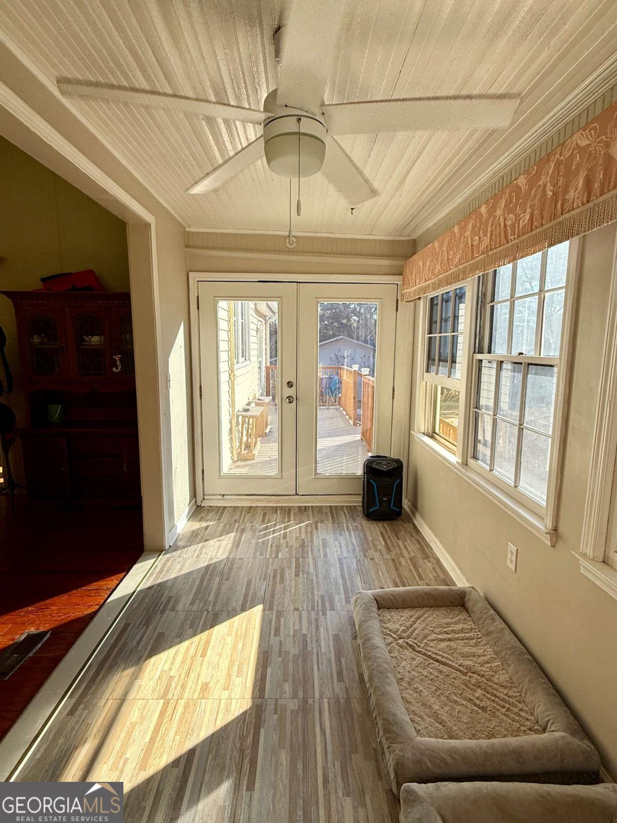 231 Bowers Street Royston, GA 30662 - Photo 11 of 28 a living room with a couch and wooden floor