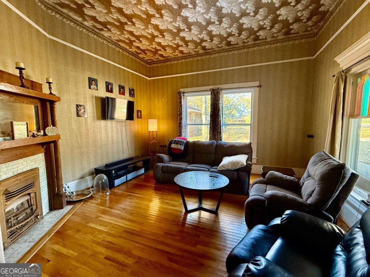 231 Bowers Street Royston, GA 30662 - Photo 6 of 28 a living room with furniture and a window