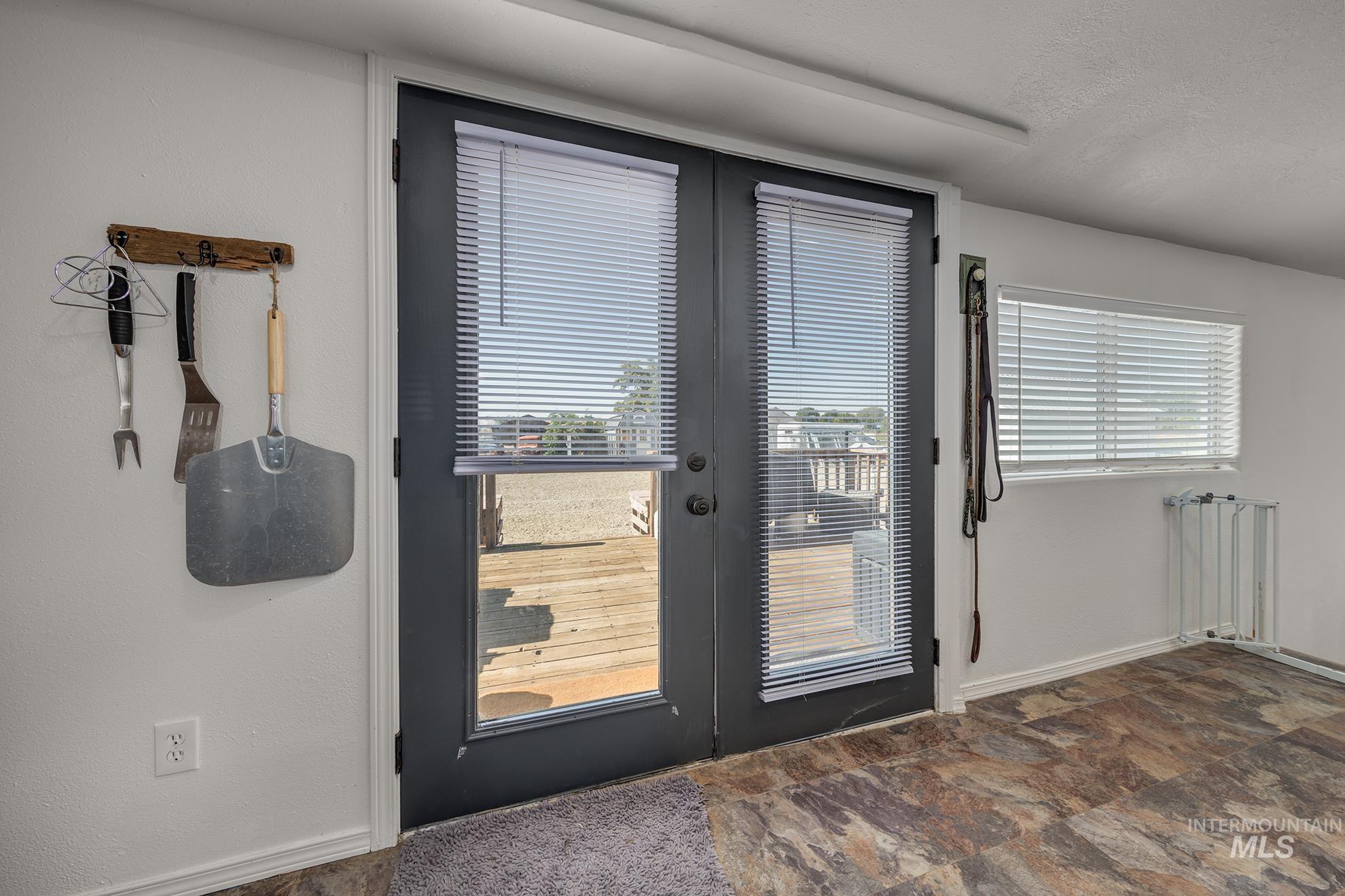 4631 Rolland Road Ontario, OR 97914 - Photo 19 of 43 Patio access through double French doors with integrated blinds