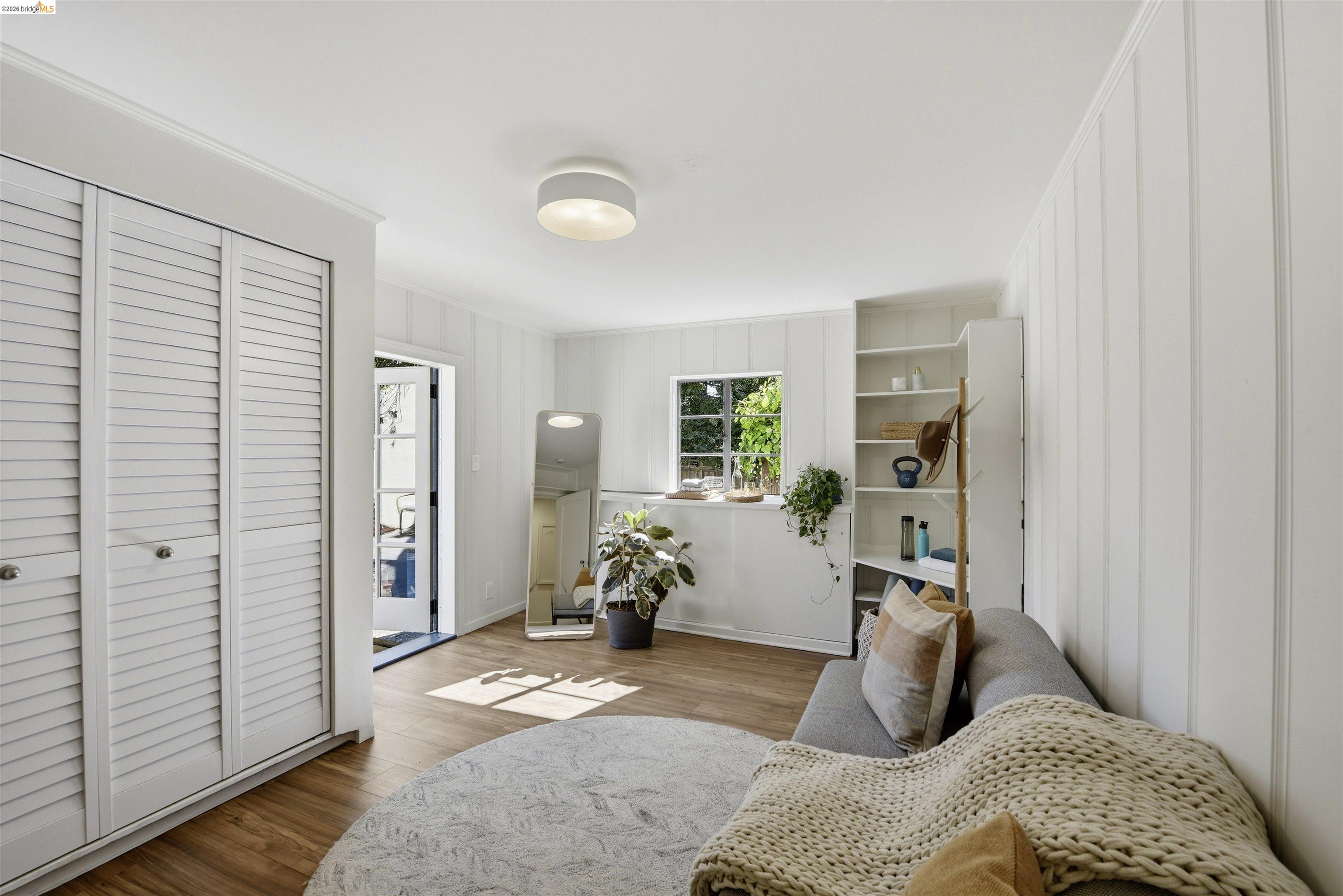 44 Highgate Road Kensington, CA 94707 - Photo 49 of 83 a bedroom with a bed and wooden floor