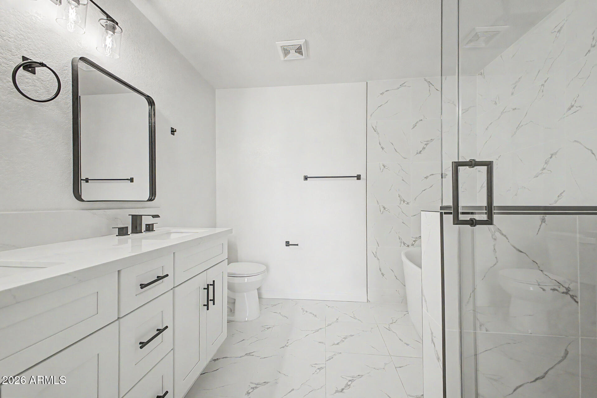 6452 West Ruth Avenue Glendale, AZ 85302 - Photo 23 of 35 a bathroom with a double vanity sink mirror and toilet