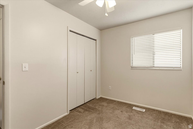 947 Canyon Road, Unit 29 Ogden, UT 84404 - Photo 16 of 19 Unfurnished bedroom featuring a closet, carpet floors, and ceiling fan